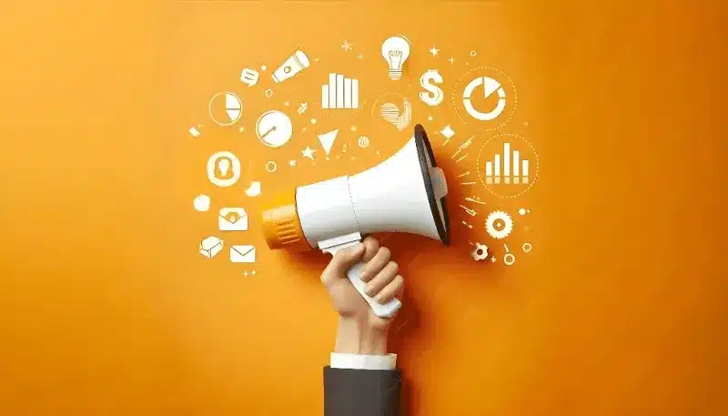 The image showcases a hand holding a megaphone, symbolizing the amplification of messages and communication.