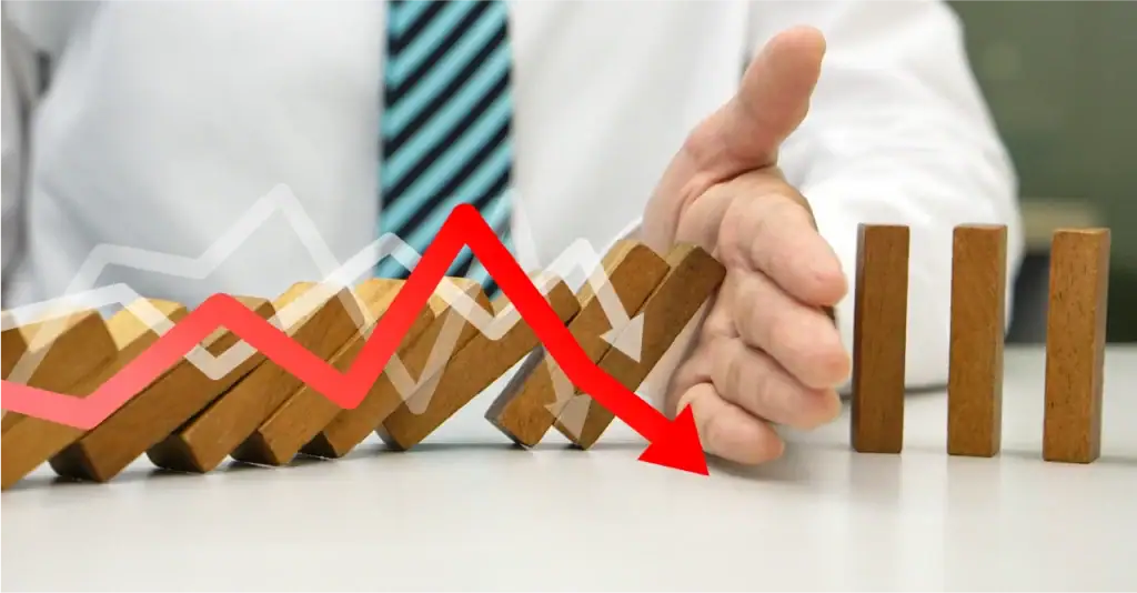 Dominoes falling, indicating crisis management.
